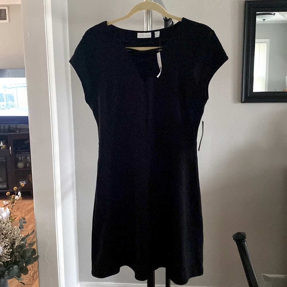 Cap sleeve mid length black dress. Brand new with tags.